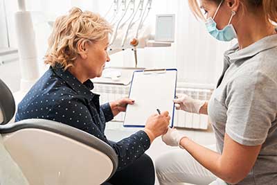 dentist reviewing financing options with patient