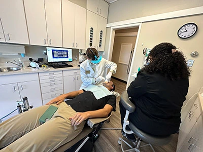 Doctor at Walnut Creek Dentists performing cosmetic dentistry services on a patient